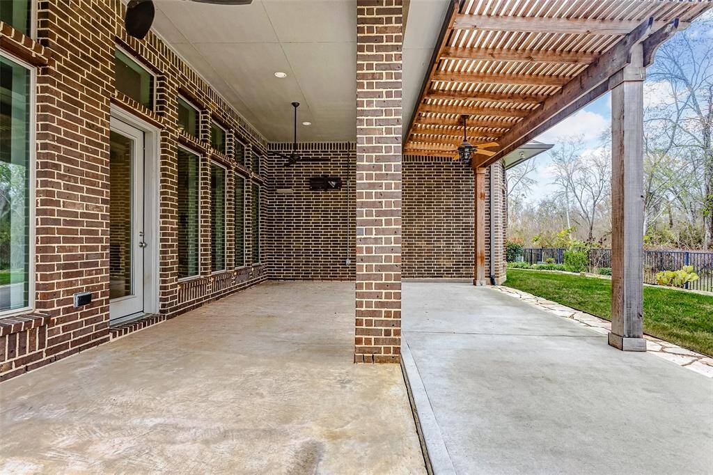 Step outside to your own private oasis, where a spacious covered patio awaits, perfect for outdoor relaxation and entertaining. The lush green space and fully-fenced backyard provide both privacy and room for outdoor activities.