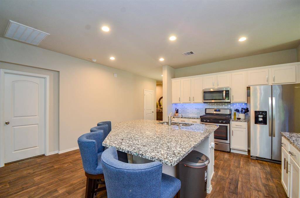 You will love the floors that carry out through all of the kitchen , breakfast, family room and entry!