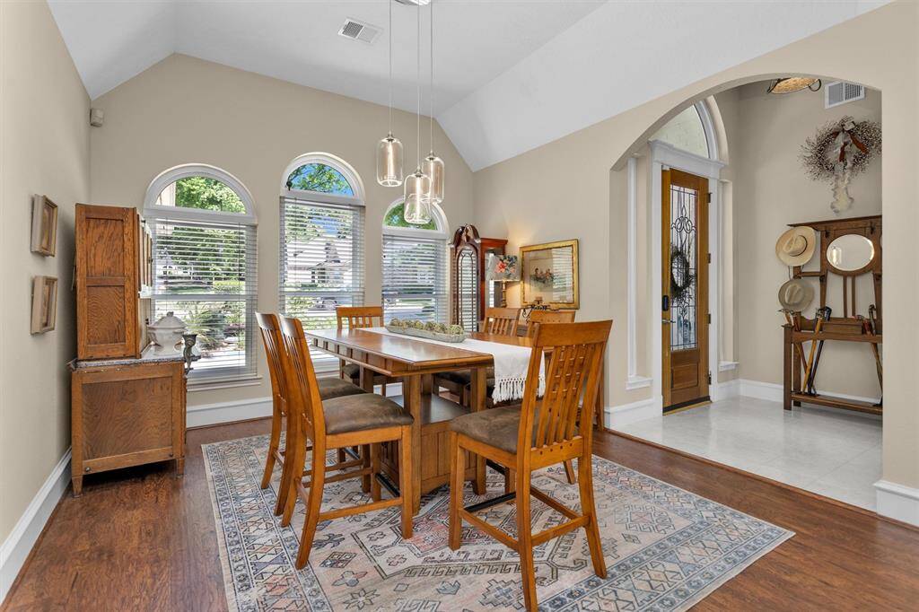 Bright and open dining space with views of the backyard, ideally located between the kitchen and living room for easy entertaining.