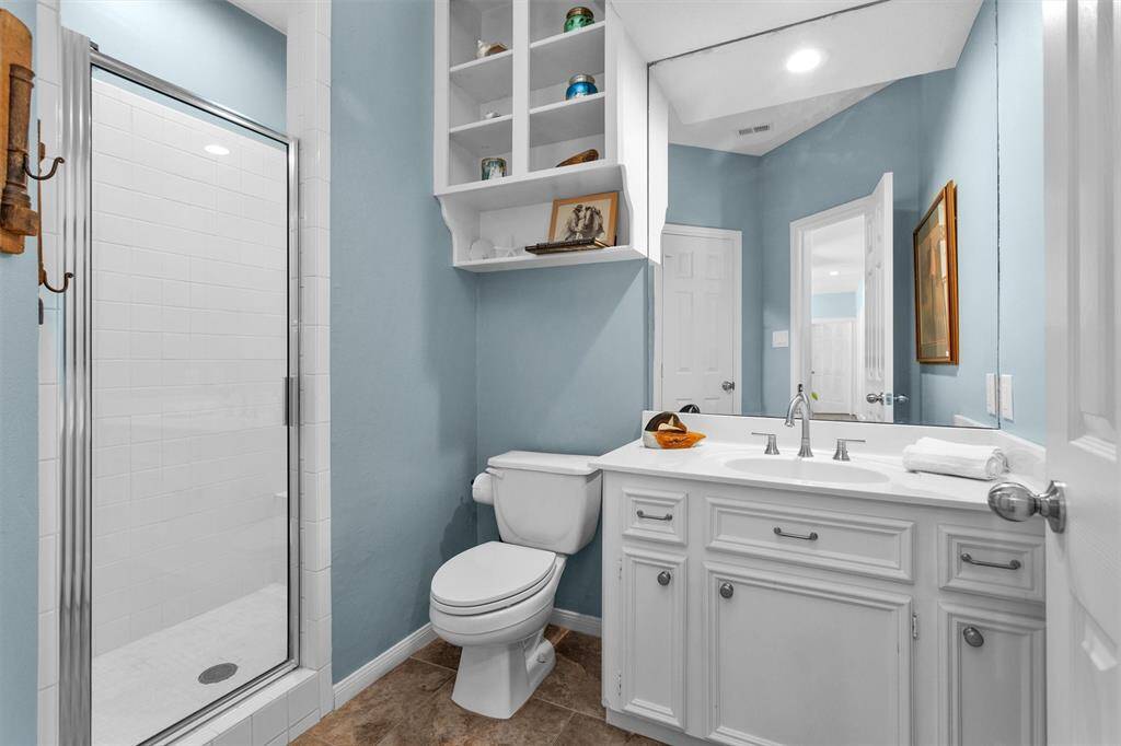 Tasteful finishes and a well-maintained design make this full bathroom convenient for guests and everyday living.
