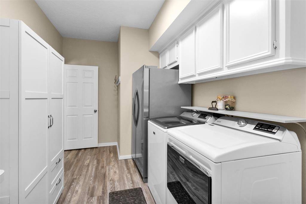 A spacious laundry area with extra room for crafting, storage, or hobbies—function meets flexibility.