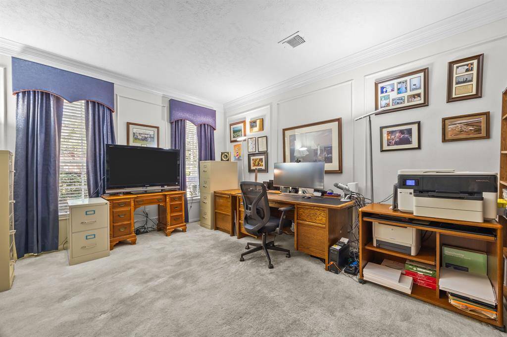 Bright and inviting home office with abundant natural light.