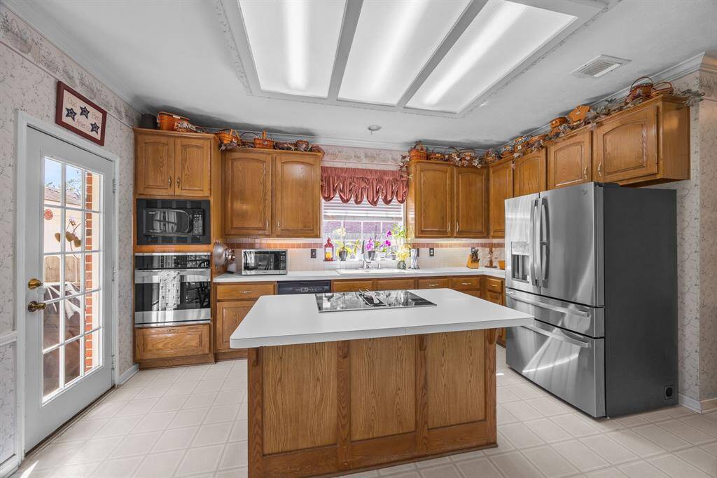 Ample storage space enhances this kitchen's functionality and charm.