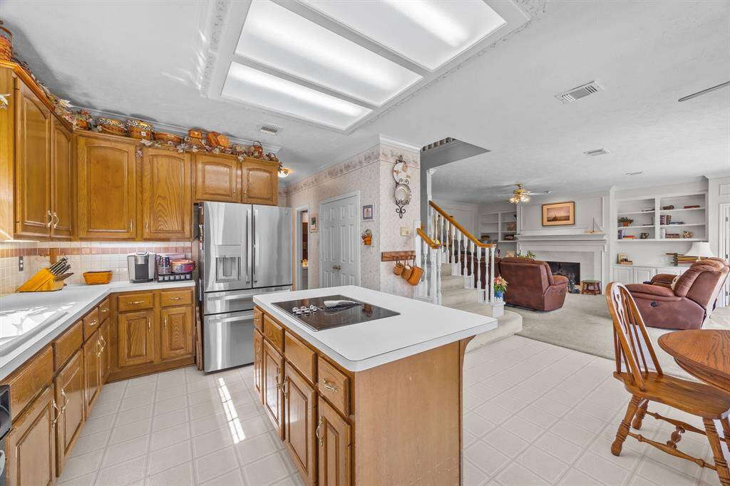 This spacious kitchen, with ample countertops and an open layout, is perfect for cooking and entertaining.