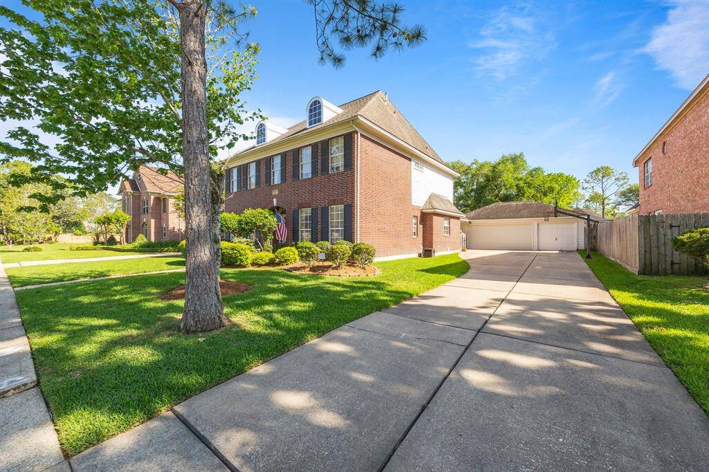 This stunning home offers a three-car garage and exceptional curb appeal.