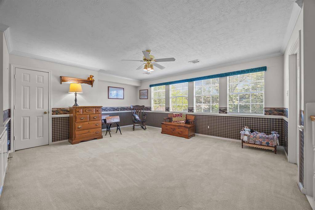 Bright and inviting second-floor game room, perfect for family fun and relaxation.