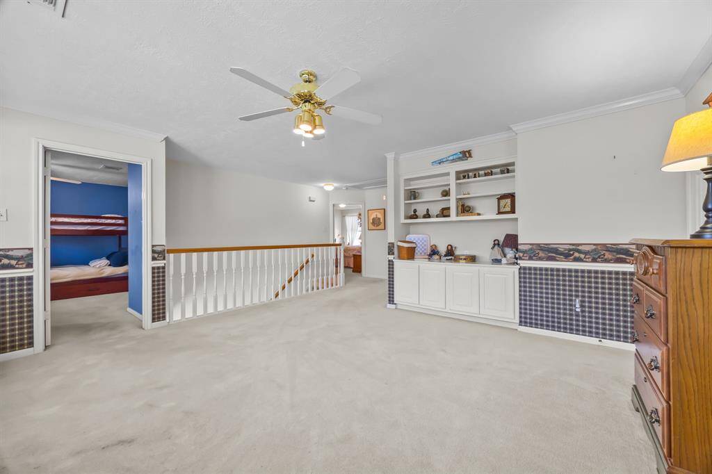 Spacious game room with convenient built-in storage.