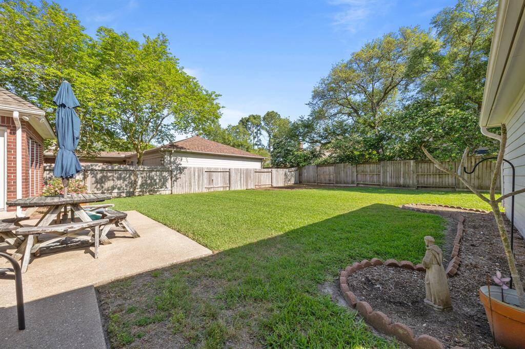 Discover this expansive backyard oasis, perfect for family fun and relaxation.