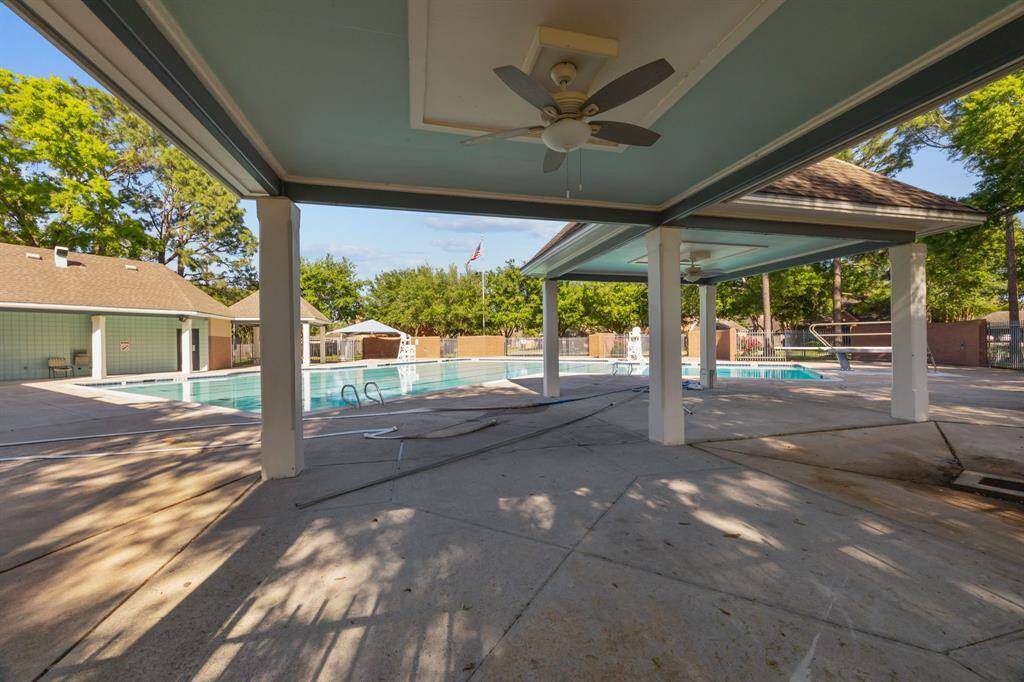 Enjoy summer days in comfort under the shaded patio of this inviting neighborhood pool.