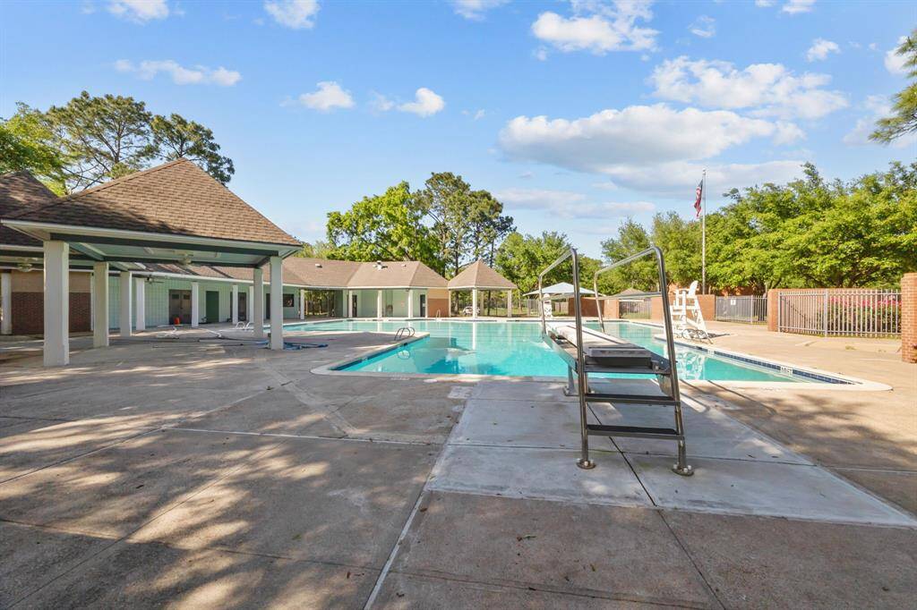 Dive into family fun with this neighborhood pool, featuring a diving board.