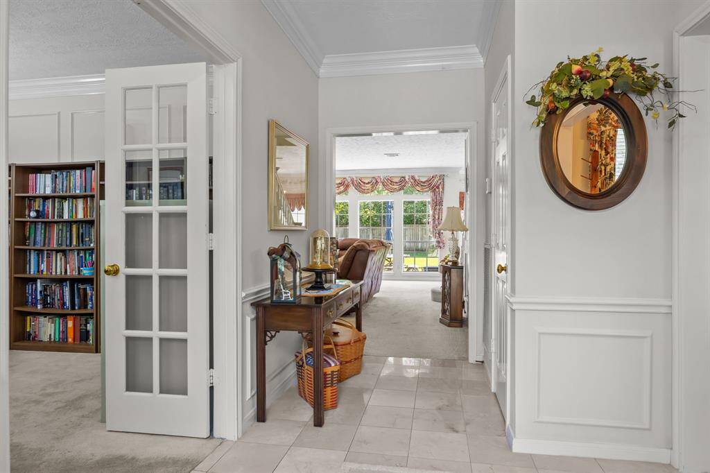 Inviting foyer opens to a study and elegant dining room.