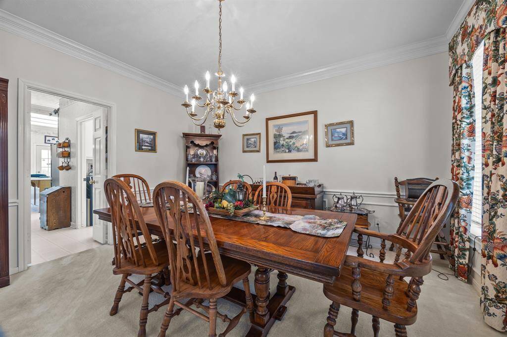 Elegant dining room seamlessly connected to the kitchen, perfect for effortless entertaining.