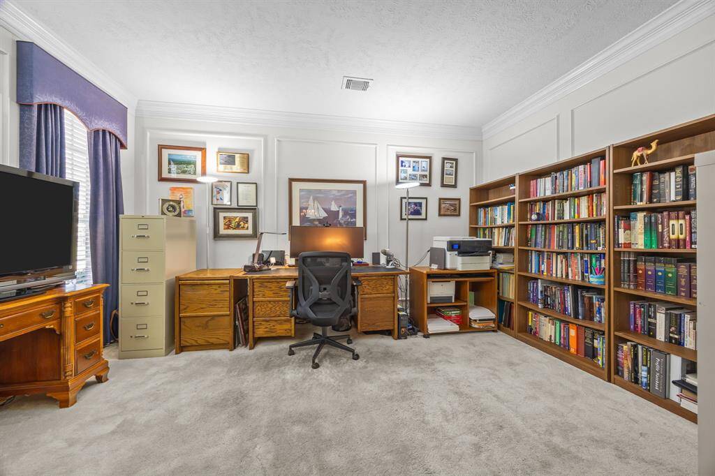 Discover this spacious home office, perfectly designed to meet all your remote work needs.