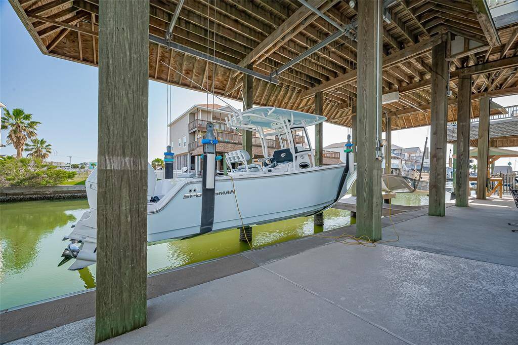 Boat house with 2 boat lifts (cables updated 2019 on 20-30 ft boat slip). They are serviced annually.
