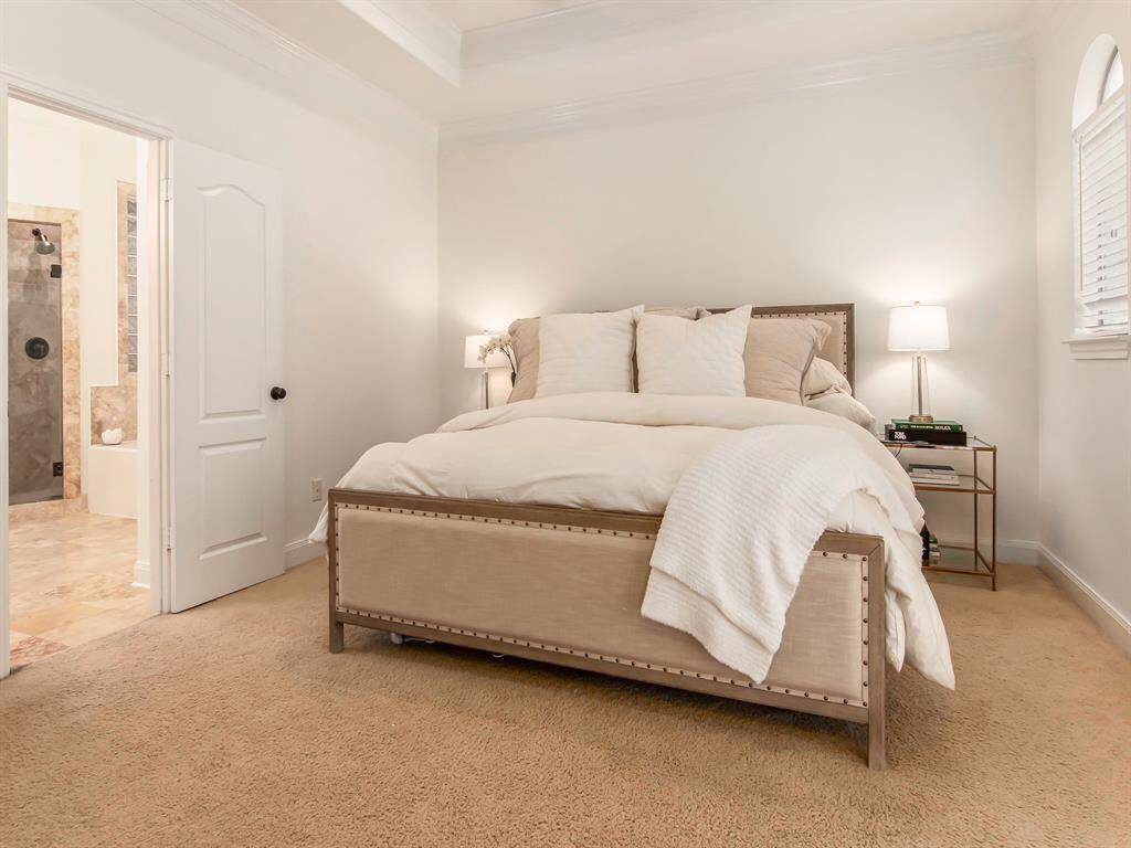 Master bedroom with tray ceilings.
