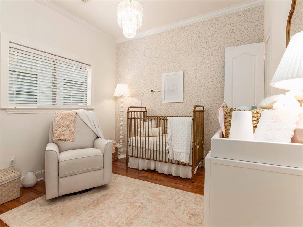 Third bedroom, wood flooring throughout.