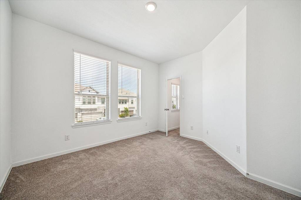 Secondary bedroom #2 features a walk-in closet and has hallway access to the secondary bath.