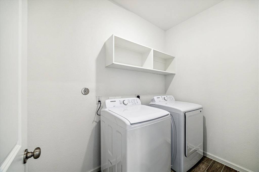 The utility room is located in the bedroom hallway. Washer and dryer are included in the sale.
