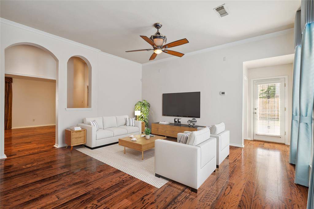 The bright and airy living room sits at the heart of the home, with the primary bedroom tucked away nearby for added privacy—separate from the secondary bedrooms for a more peaceful retreat.** Virtually Staged