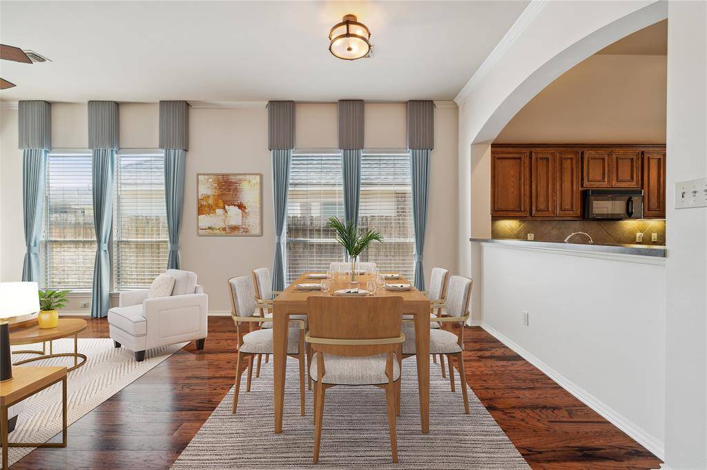 The formal dining room is perfect for hosting intimate dinners and flows effortlessly into the living room. With easy access to the kitchen, serving and entertaining guests is a breeze.** Virtually Staged
