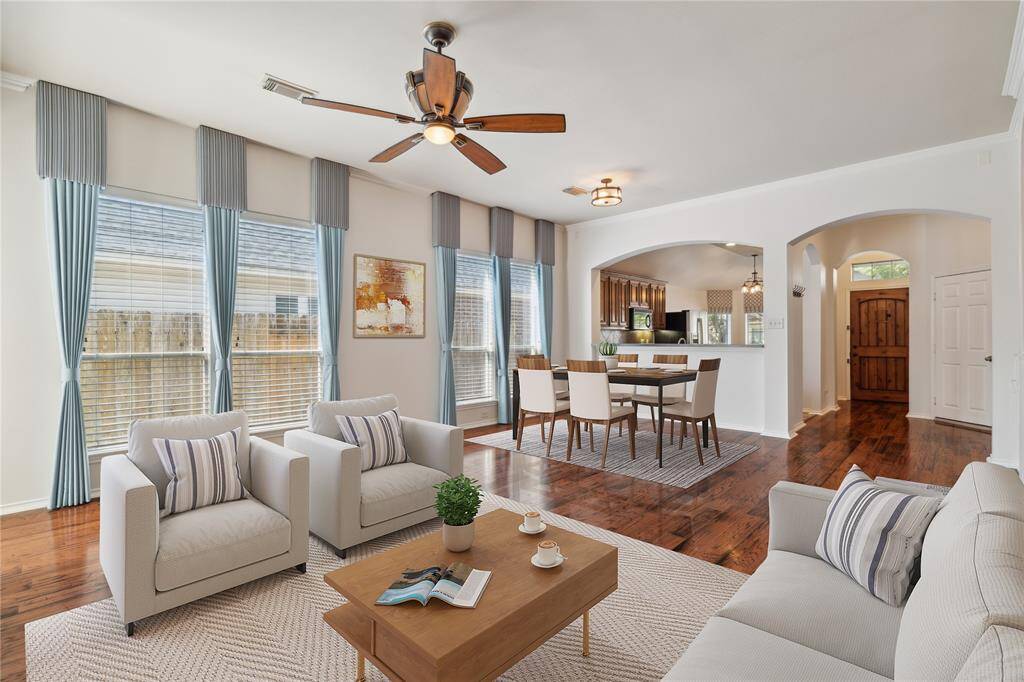 With an open floor plan and rich hardwood flooring, the dining room flows seamlessly into the living room—making it easy to host family and friends in comfort and style.** Virtually Staged
