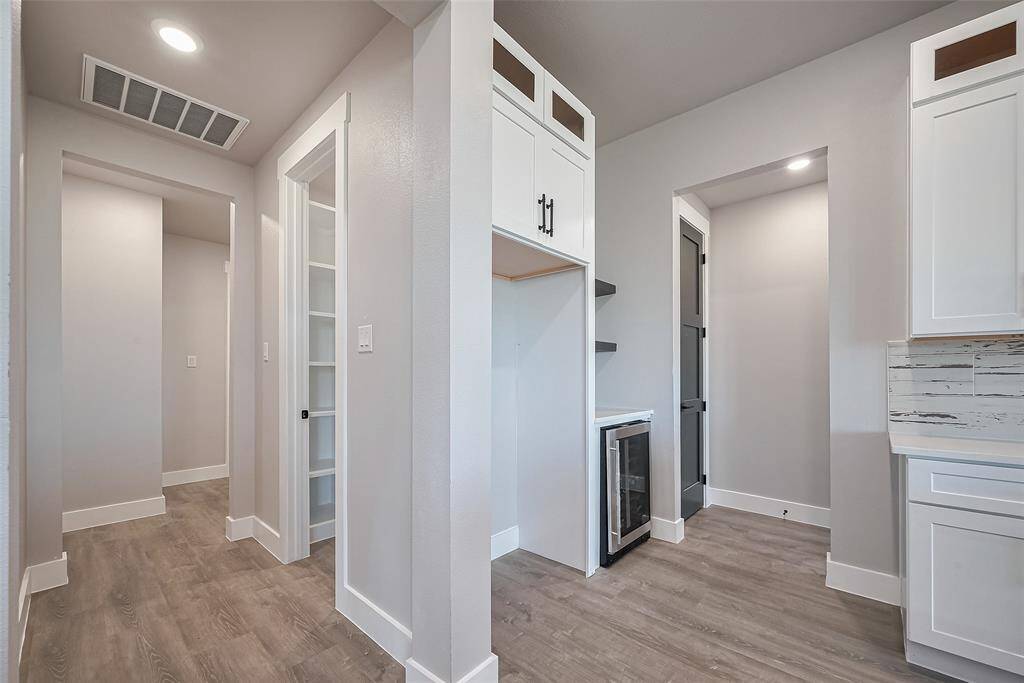 Hallway to the garage, utility room and mud room