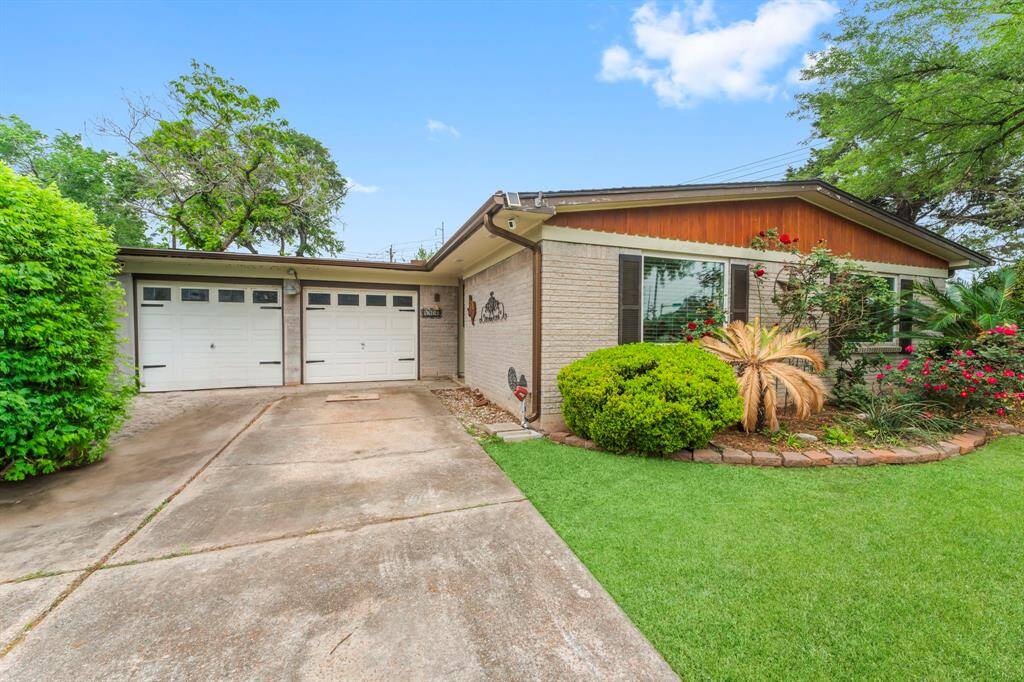 Charming home with insulated garage, garage door openers and driveway with plenty of parking