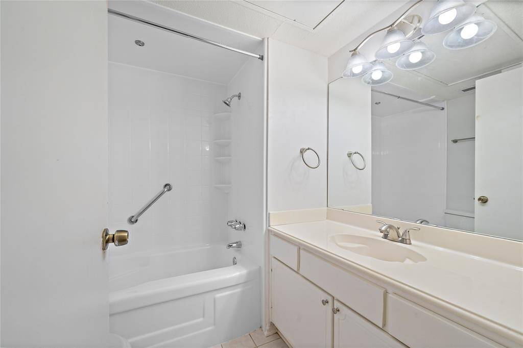 Second bathroom features a bathtub.