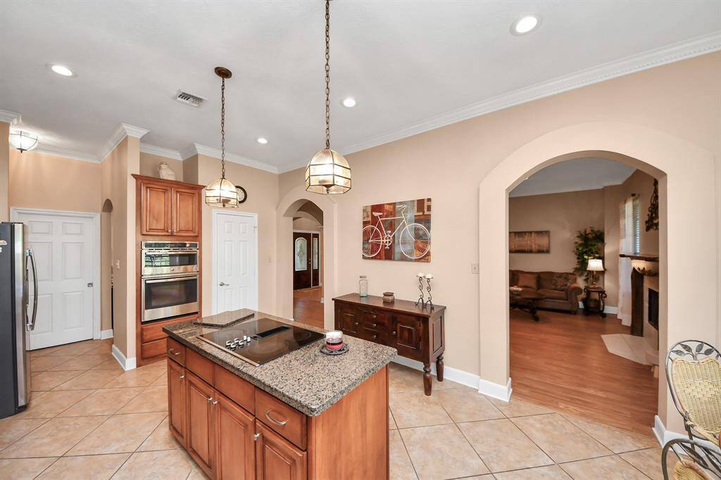 View of kitchen facing the den