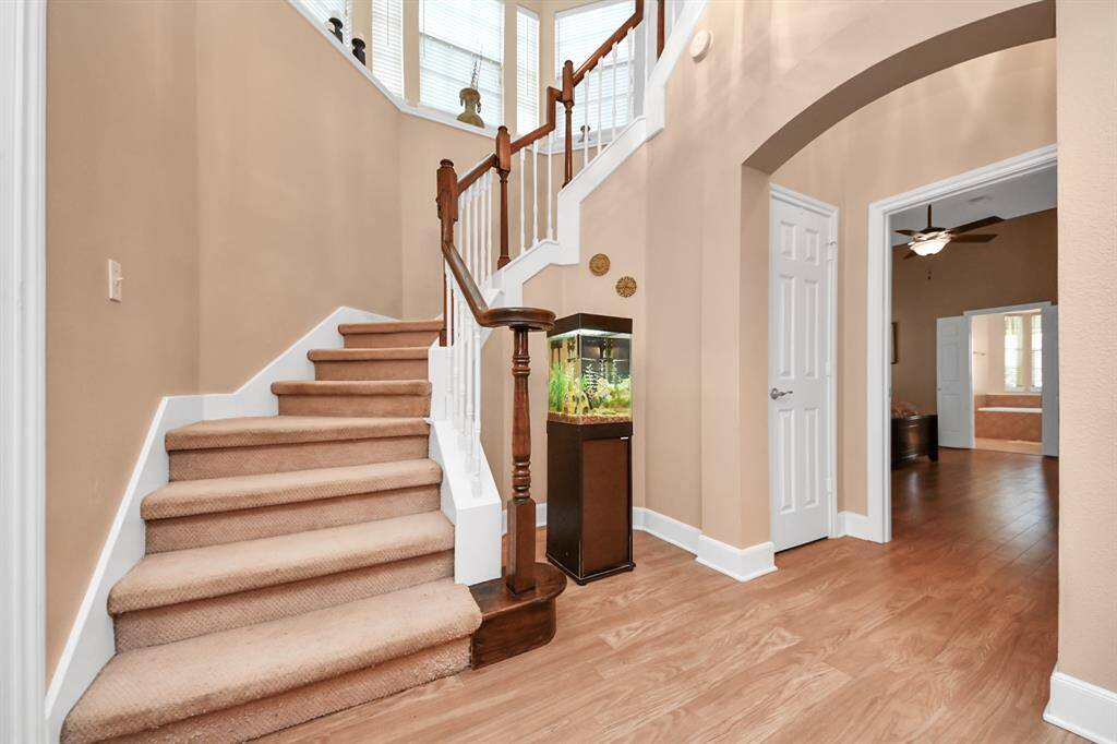 Left of the foyer are the stairs leading to the second floor