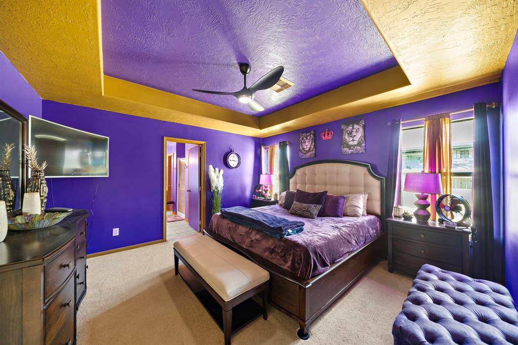 Spacious primary suite offering a relaxing retreat. Features include a large bedroom area, an en-suite bathroom, and ample closet space. Enjoy privacy and comfort in this well-appointed space
