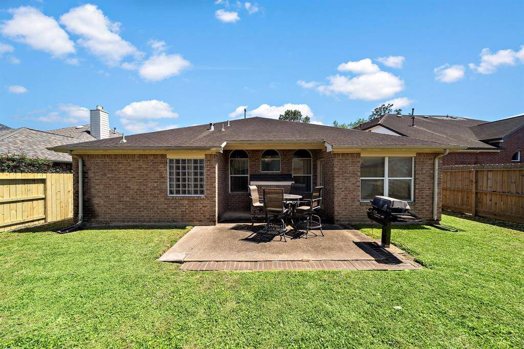 Patio provides ample space for grilling and outdoor dining.
