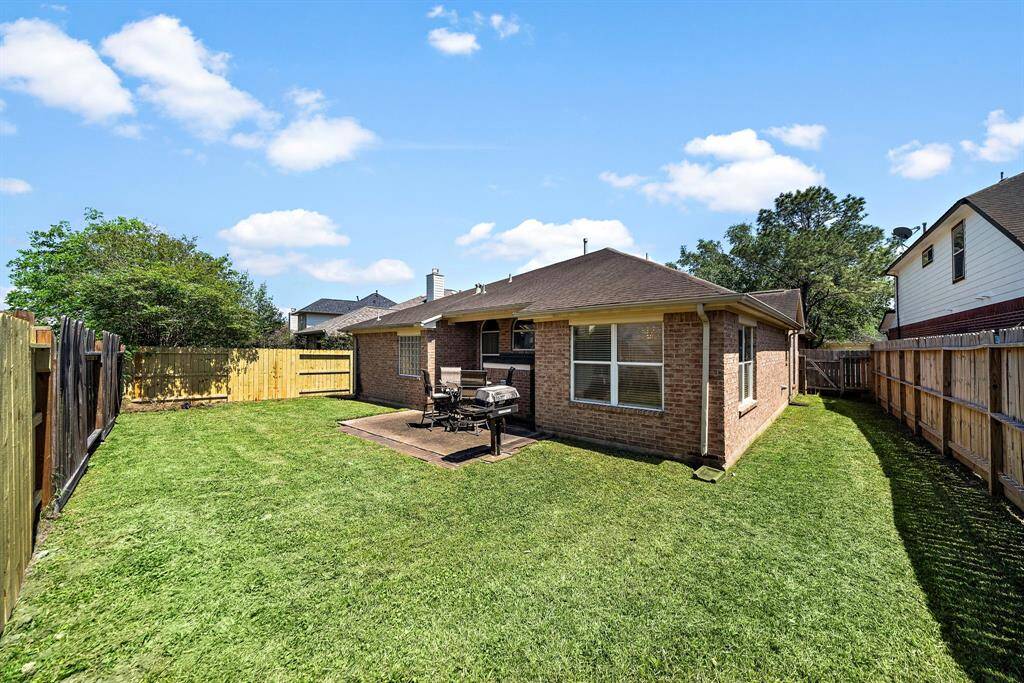 Enjoy a spacious backyard, perfect for outdoor activities and entertaining