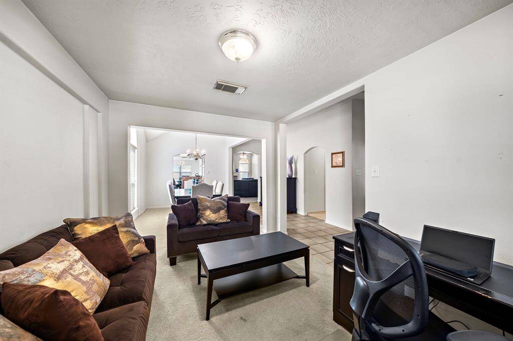 Versatile office/study opens into the formal dining, ideal for work-from-home or entertaining.