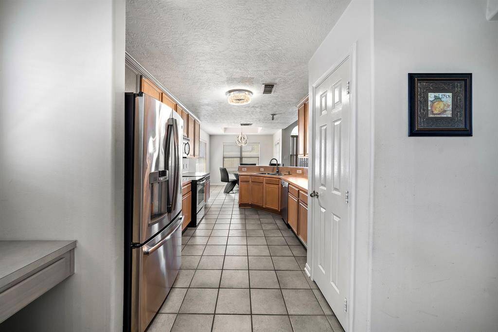 Kitchen leading to dining area, great for entertaining