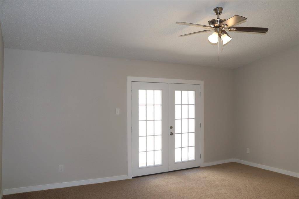 Primary Bedroom View of Courtyard Double Doors