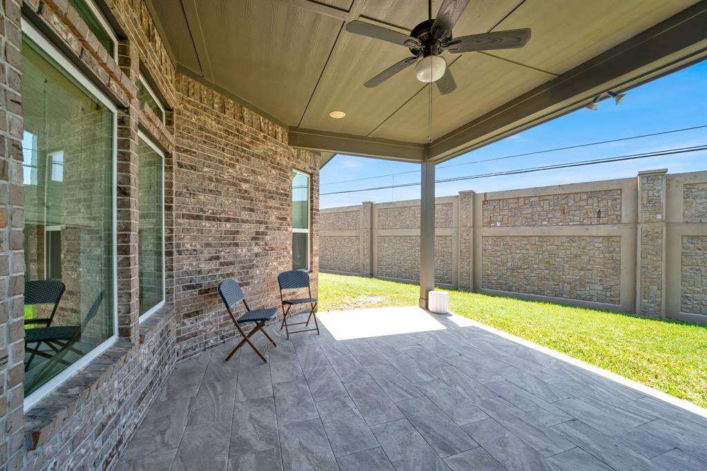 Large covered patio to enjoy your backyard. Maybe a cookout?