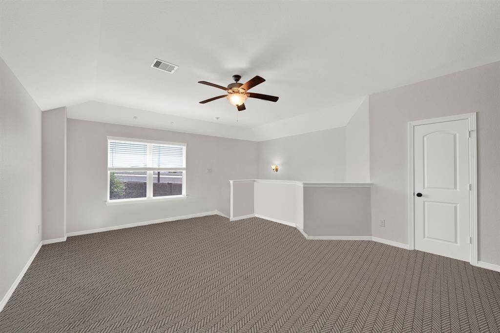 Gameroom upstairs, also with an upgraded 1 yr old carpet and new paint. Half a bathroom also upstairs.