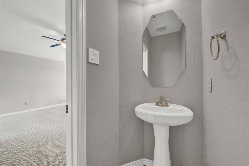 Powder room upstairs next to the gameroom and media room.