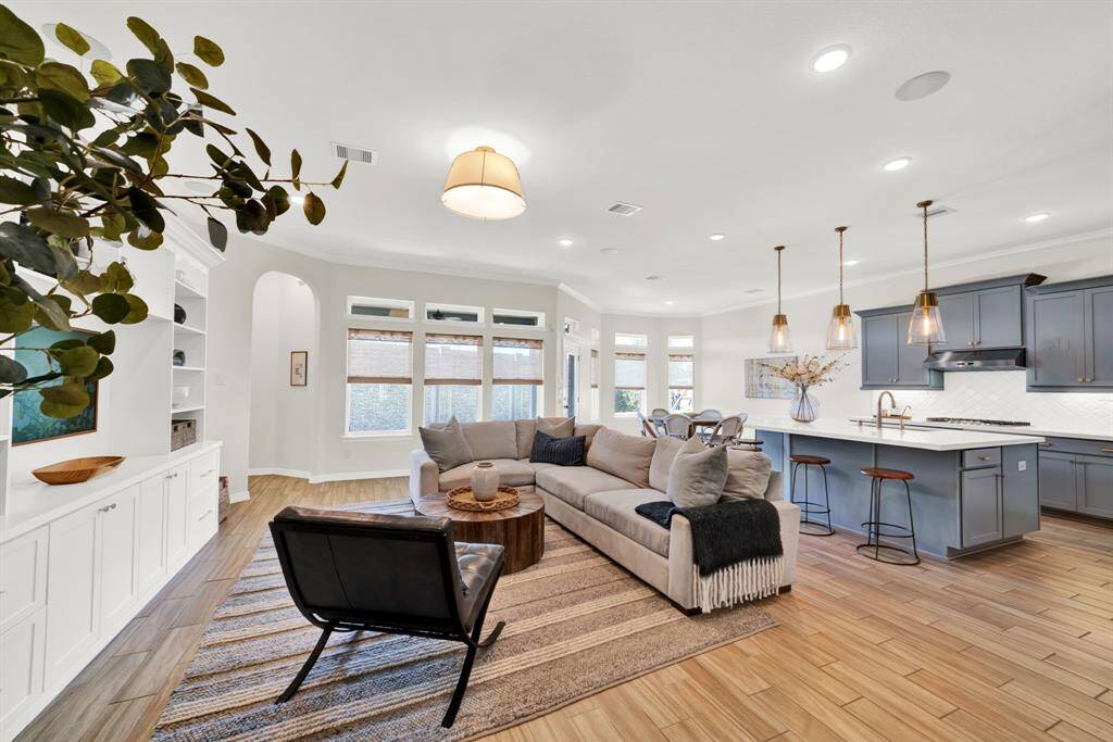 Spacious area with high ceilings and crown molding