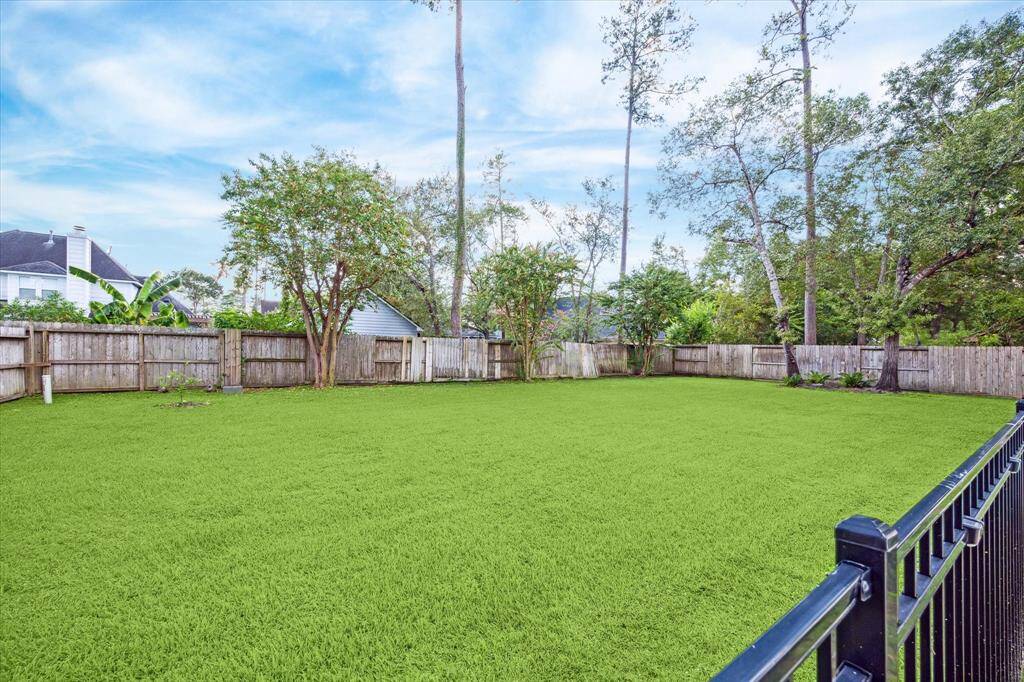 Expansive green space fenced off from the pool area for your furry friends