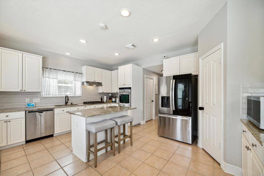Granite countertops throughout the kitchen