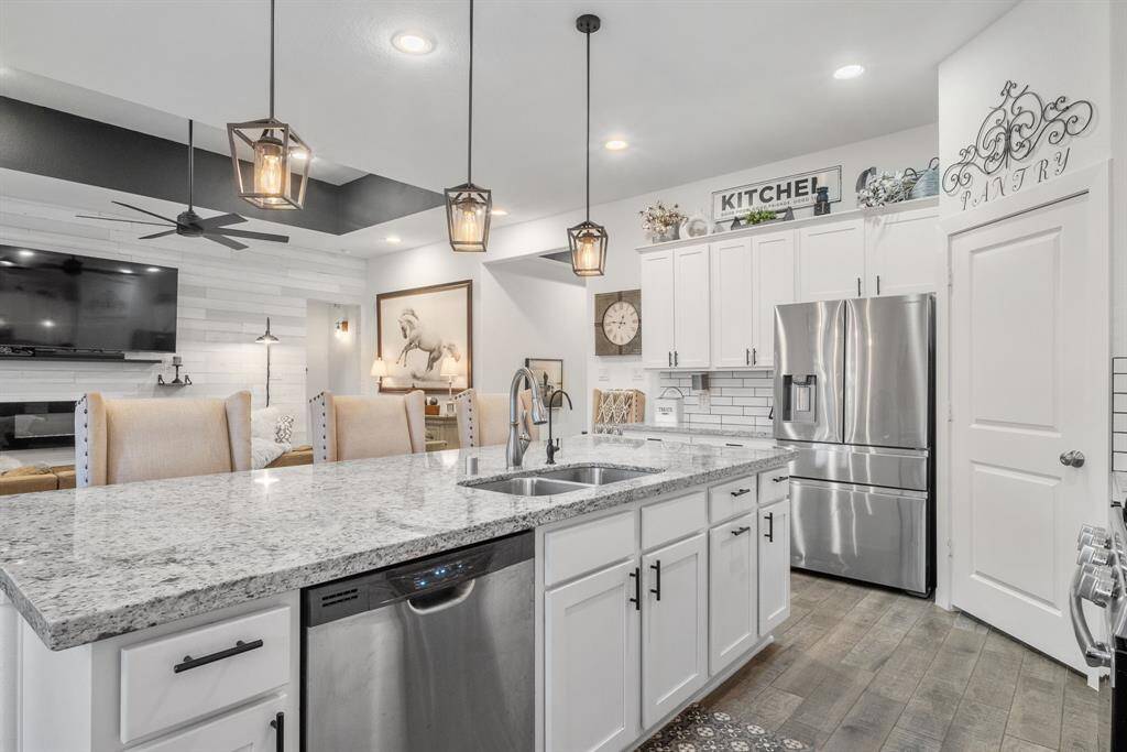 This kitchen design has perfect views into the living space that is perfect for entertaining.