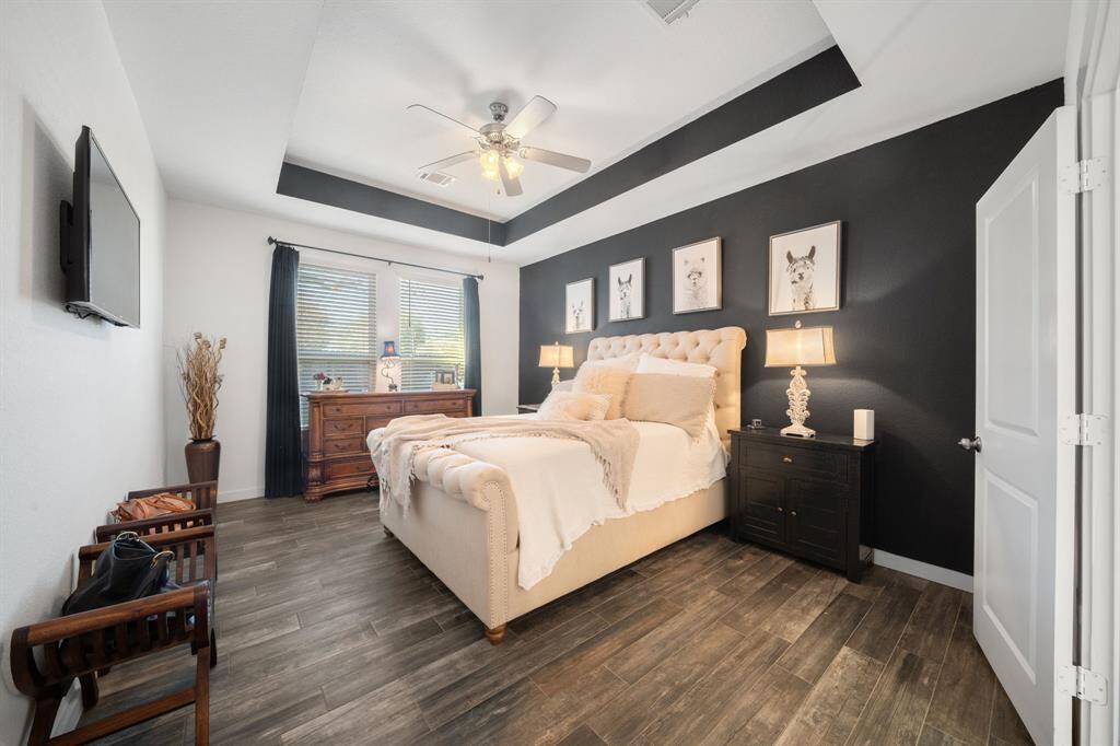 The primary bedroom is spaced away from the living room area creating privacy.