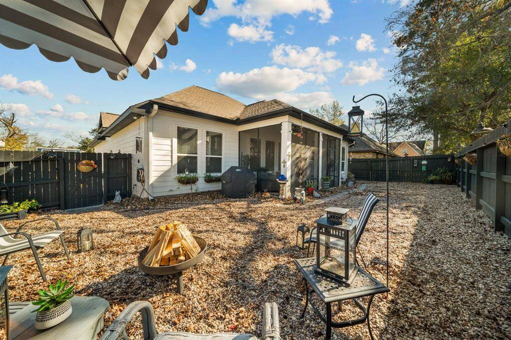 Fire pit and sitting area. Current grill is setup to gas connections next to patio, perfect for an outdoor kitchen.