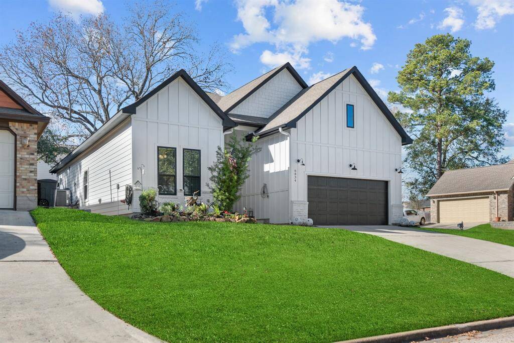 Beautifully landscaped front space with a large entry way patio.