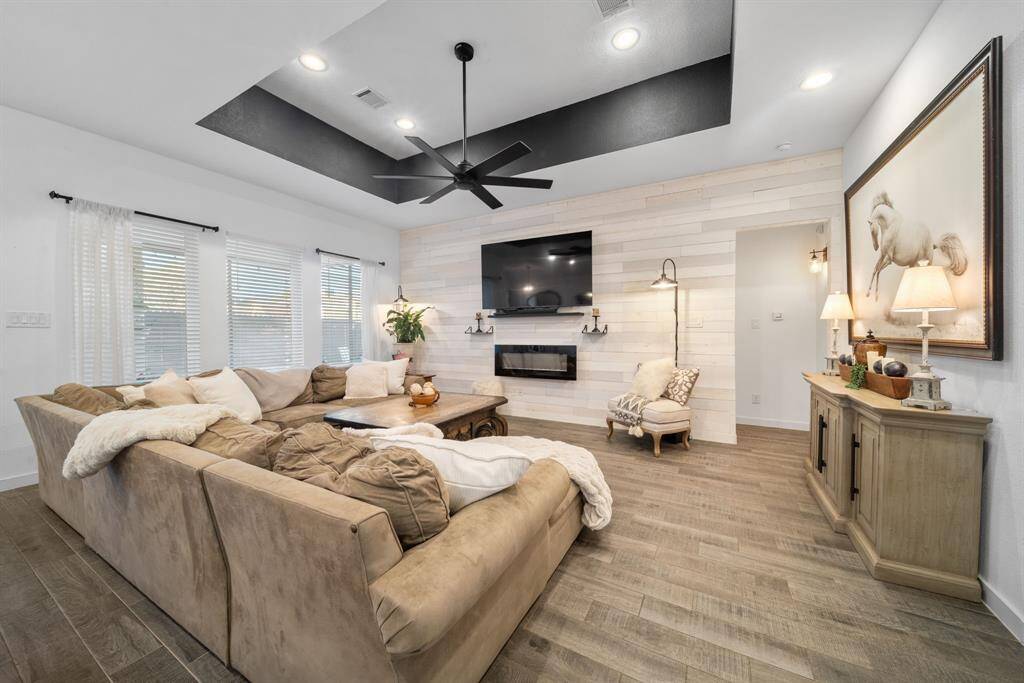 Spacious living area with many opportunities to stage this space many ways you see fit.
