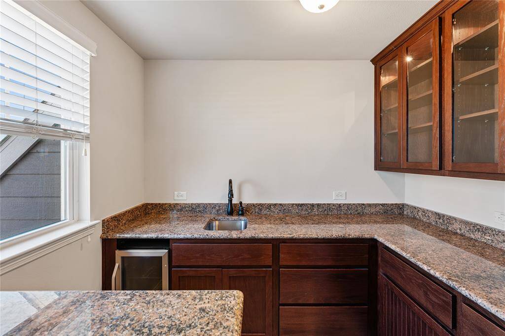 While entertaining in the family room, take advantage of the built-in wet bar, and cabinets with accent lighting! Mix cocktails for friends, pour a glass of red wine for your sweetheart, and intentionally and happily enjoy their company!