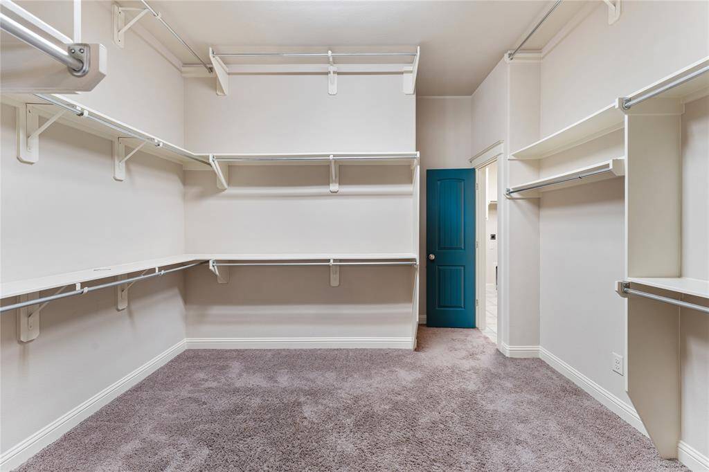 No matter how often you purchase new threads online or at the mall, this walk-in master bedroom closet has space for all your new and favorite wares! High ceilings also afford the possibility of additional shelving or easy stacking.