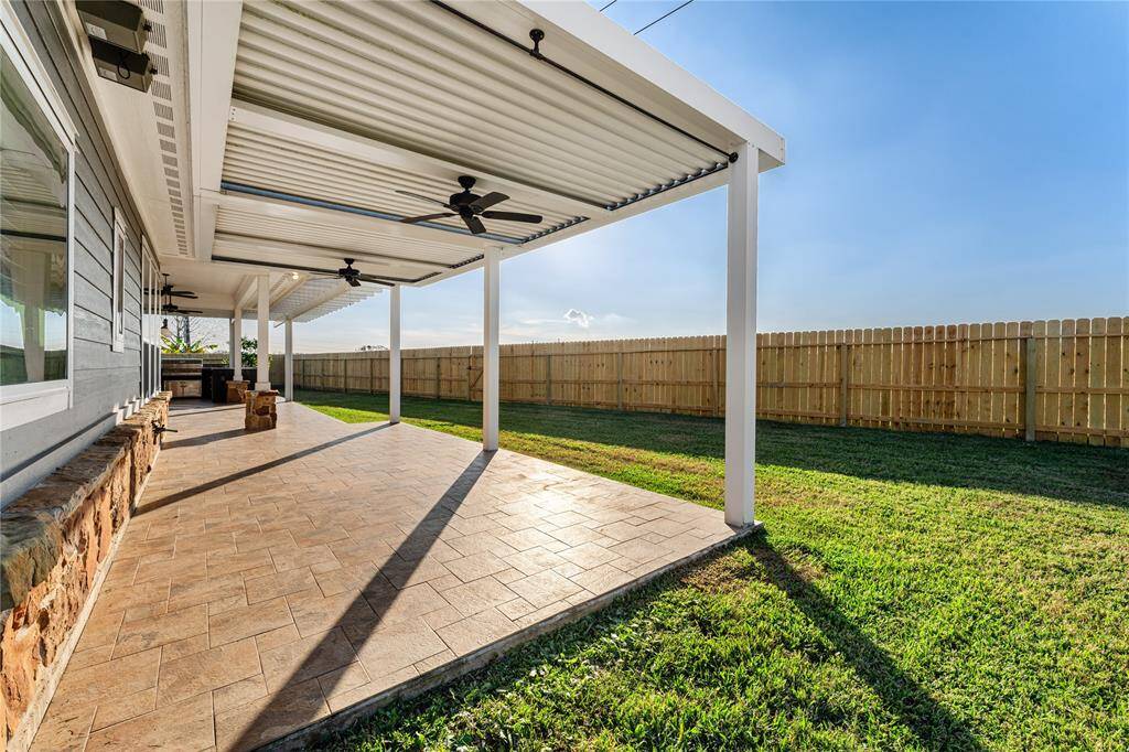Bask beneath the covered patio and relish in the cooling effects of the outdoor ceiling fans! Even on hot Texas days, this luxurious space affords the ability to enjoy the outdoors in comfort and style!